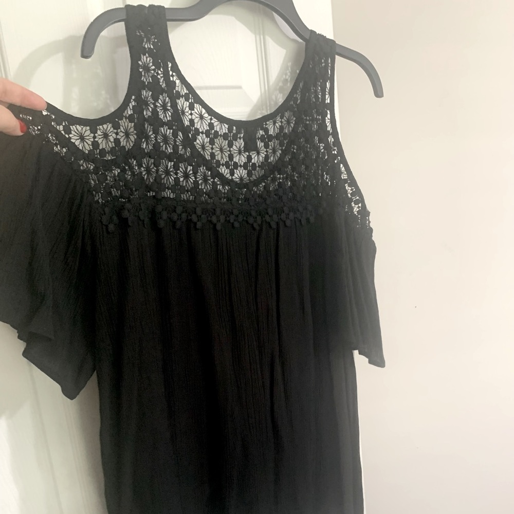 Black dress blouse. Loose fitting. Shoulder open.